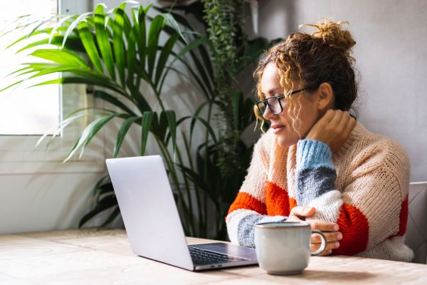 Woman looking at her computer at crossings at marsh